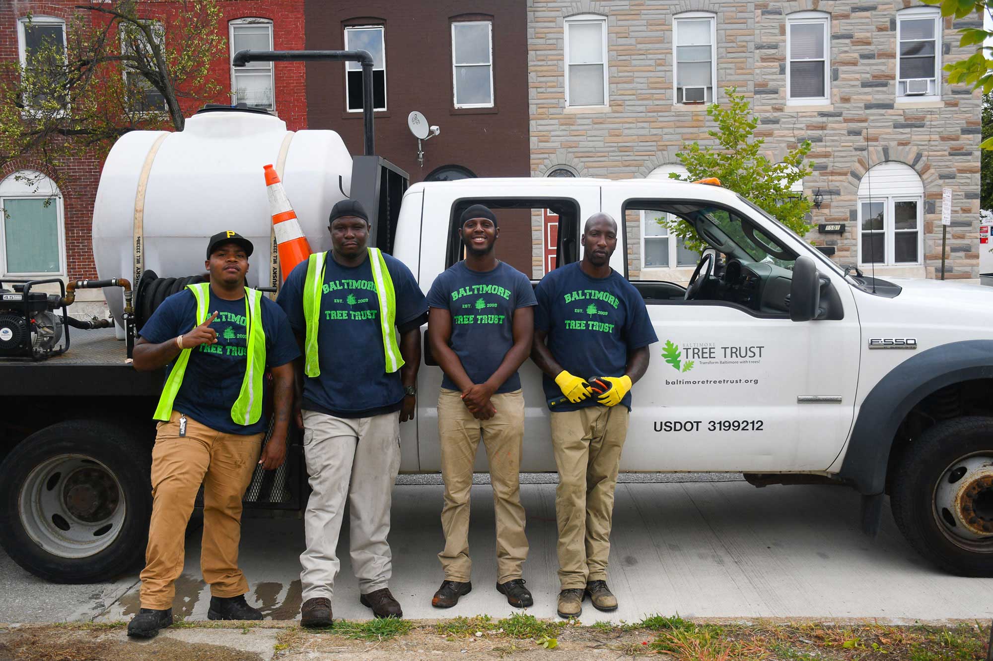 photo of Kwamel Couther and other Baltimore Tree Canopy crew members