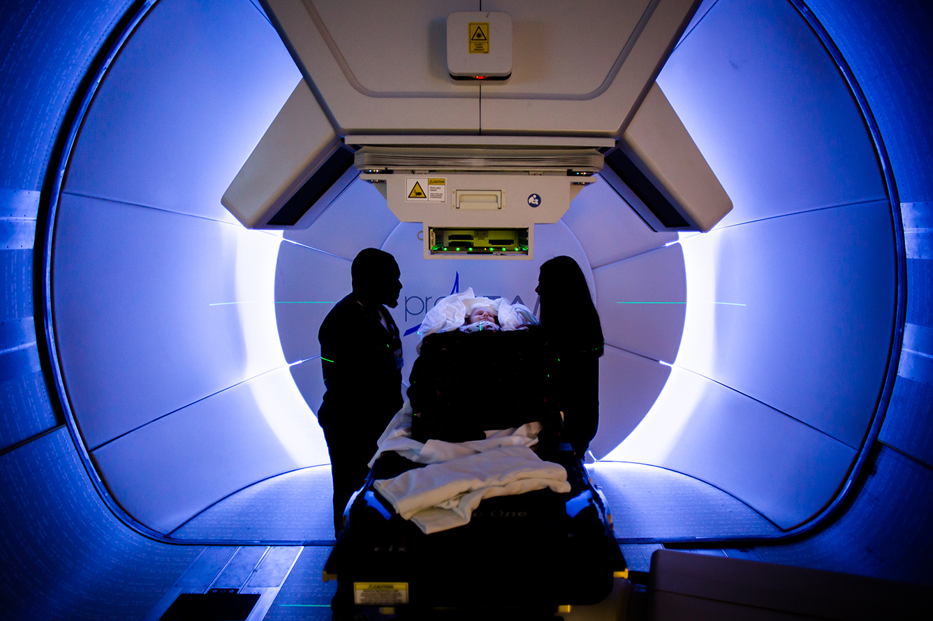 ellaTreatment Staff at the Maryland Proton Treatment Center align Ella for proton radiotherapy treatment, which focuses a pencil-width beam of protons on Ella’s tumors as a non-invasive alternative to surgery.(Photo by Aaron Rosa)