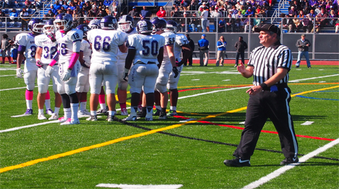 Tom Falcinelli officiates a game between Bishop O’Connell High School and Gonzaga College High School Oct. 13 in Arlington, Va. (Photo by Matthew McNab/Capital News Service)