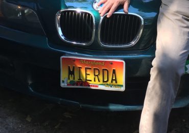 John T. Mitchell poses with his car’s “MIERDA” license plate, which the Maryland Motor Vehicle Administration recalled in 2011. The plate is the subject of a case in the Maryland Court of Appeals. Sept. 14, 2016. (Courtesy photo from John T. Mitchell.)