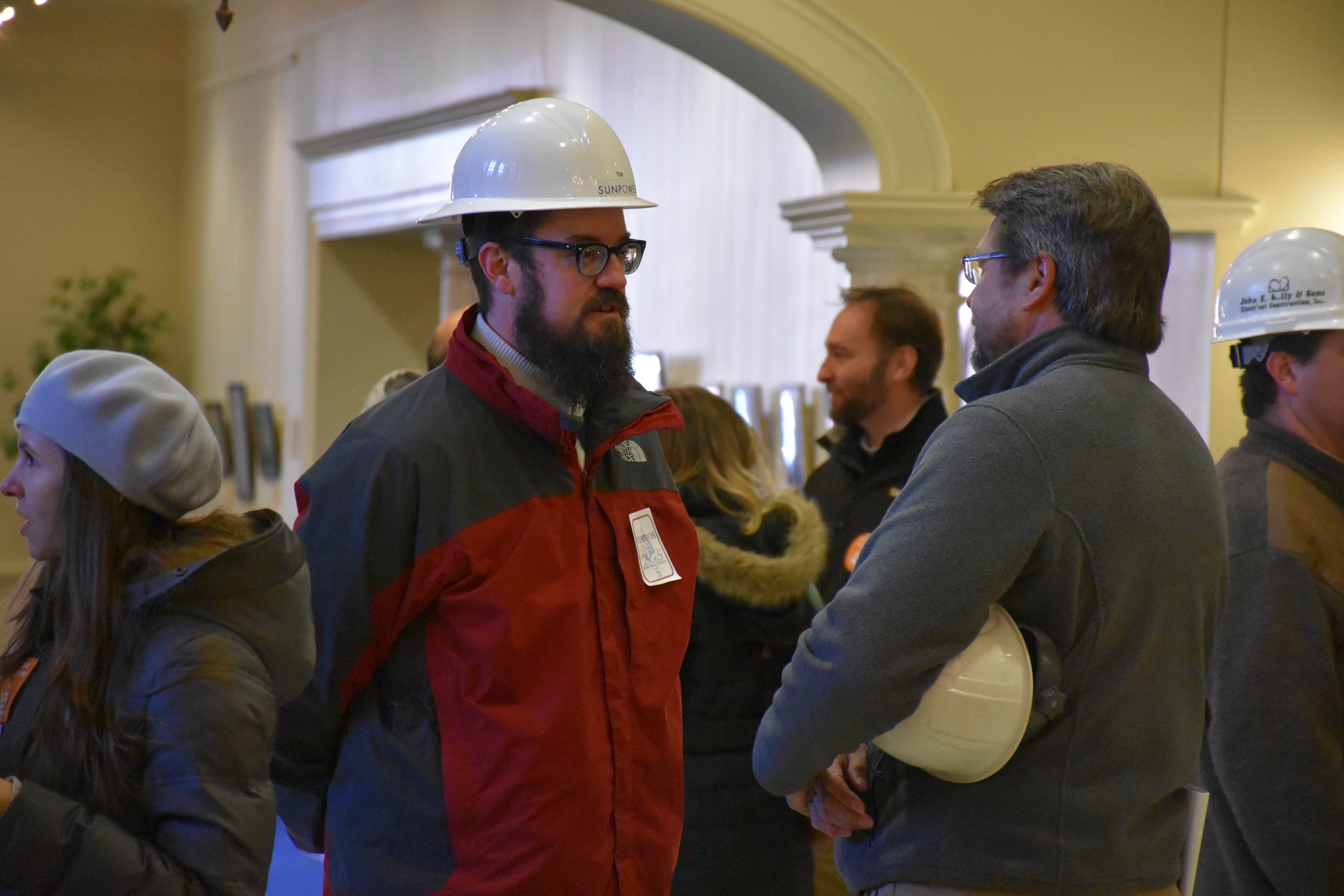 Solar workers Tim Gillen, left, and Harry Benson arrive in Annapolis on Thursday, February 11, 2016, to show support for pending legislation that would require electric companies to reduce the time it takes to connect customers’ energy panels to their power grids. (Capital News Service photo by Leo Traub)
