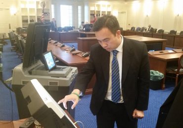Most voters in Maryland will fill out a paper ballot with a pen to vote in the primary elections in April. Some disabled voters will fill their ballots out on touch-screen machines like the one Delegate Mark Chang, D-Anne Arundel, tested out in Annapolis on Friday, January 29, 2016. (Capital News Service photo by Rachel Bluth.)