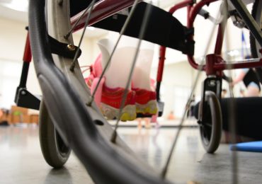 A dance helper assists one of the ballerinas during the Music and Motion class. Photo by Karen Tang/ Capital News Service.