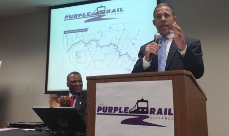 Lt. Gov. Anthony Brown expresses his approval for the Purple Line as Prince George's County Executive Rushern Baker applauds. "Maryland is neither a blue state nor a red state. We are a purple state," said Brown at a real estate agency in Greenbelt on Thursday.