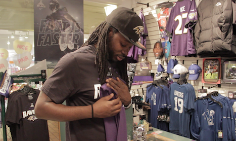 Xavier Dandridge, manager of The Sports Shop in the Inner Harbor, has seen business boom during the Ravens' Super Bowl run. (Capital News Service photo by Louie Dane).