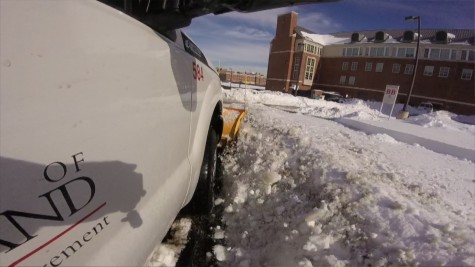 Luis Alfonzo drives a snowplow through campus just two days after 22 inches fell in College Park