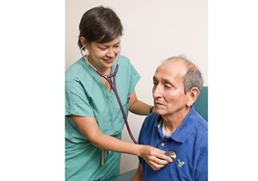 A doctor examining an elderly patient