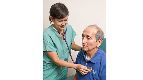 A doctor examining an elderly patient