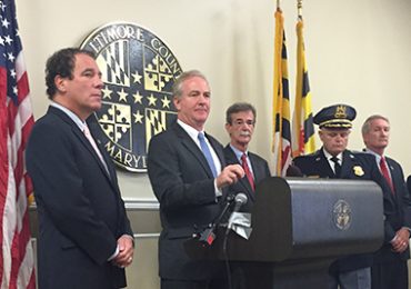 Congressman Chris Van Hollen addressing the media at the Baltimore County Courthouse as Attorney General Brian Frosh looks on. Photo by Sharadha Kalyanam
