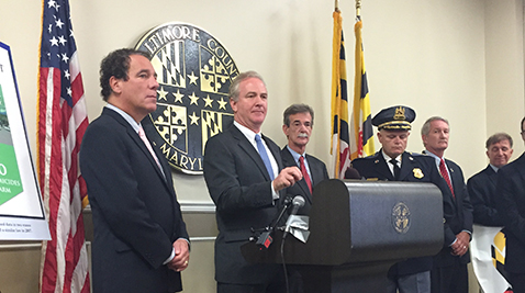 Congressman Chris Van Hollen addressing the media at the Baltimore County Courthouse as Attorney General Brian Frosh looks on. Photo by Sharadha Kalyanam