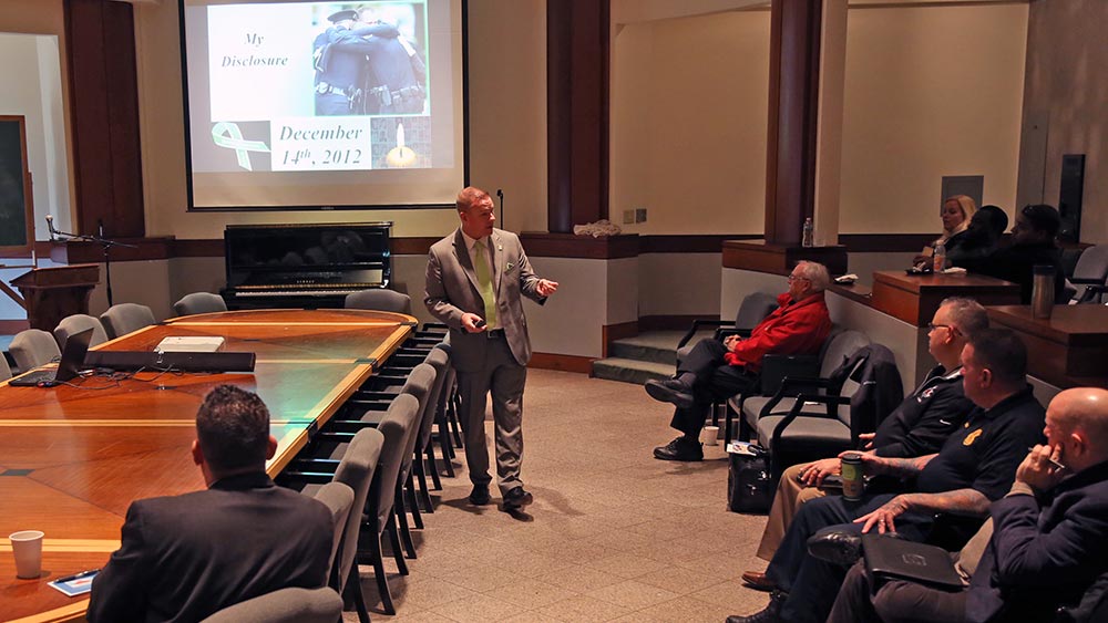 Dan Jewiss, standing, a state trooper from Connecticut, at a school safety seminar at St. John’s College in Annapolis, Md., on January 19, 2017. (Hannah Klarner/Capital News Service)
