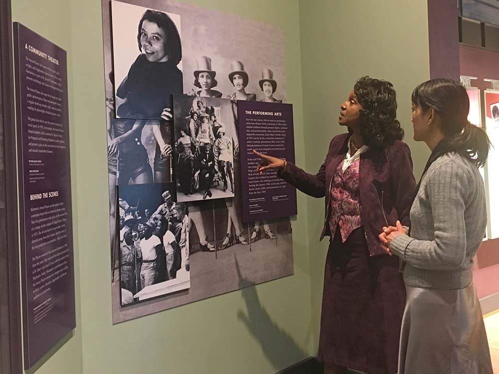 Wanda Draper, executive director of the Reginald F. Lewis Museum in Baltimore, Md., and Helen Yuen, director of marketing, look at the performing arts exhibit on display on March 9, 2017. (Brianna Rhodes/Capital News Service)