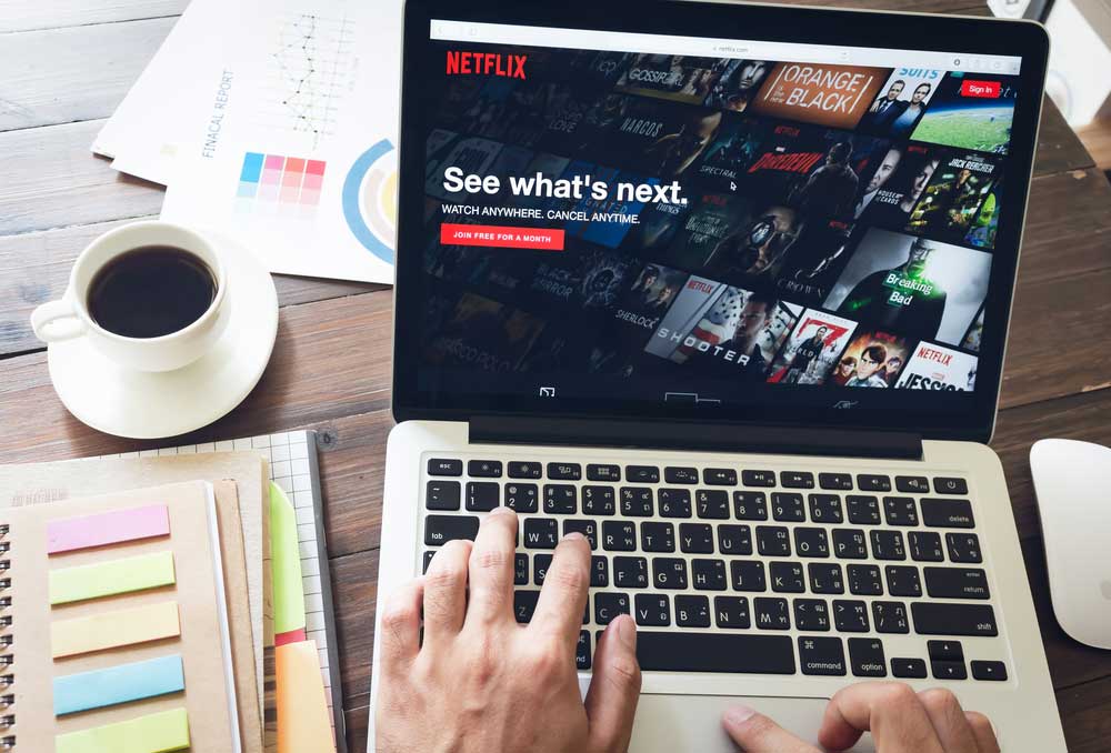 Netflix app on Laptop screen. Netflix is an international leading subscription service for watching TV episodes and movies.