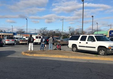 Day laborers await an opportunity to work at Langley Park Plaza. (Capital News Service photo by Gaby Galvin)