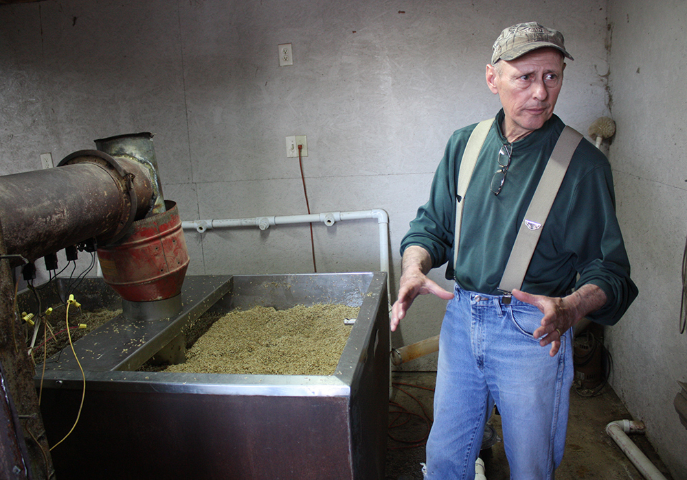 Farmer Greg Clabaugh explains how to malt grains for brewing at his farm in Keymar, Maryland. (Photo by J.F. Meils/Capital News Service)