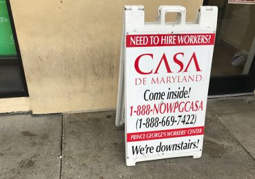 A sign outside the offices of CASA de Maryland, the largest Latino and immigrant advocacy organization in the Washington area. The organization says companies and homeowners who hire workers sometimes short-change them. (Capital News Service photo by Gaby Galvin)