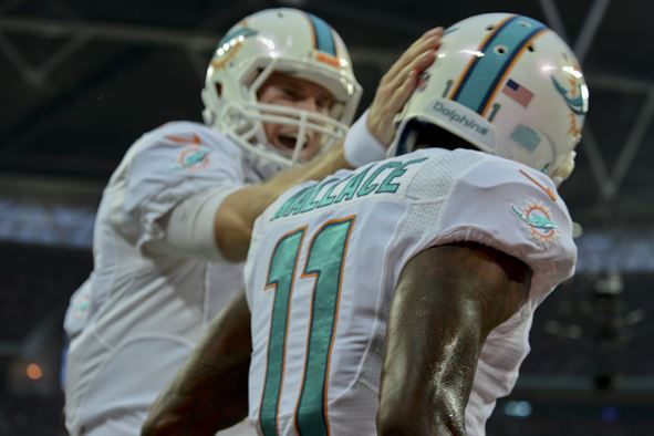 Mike Wallace (right) and Ryan Tannehill celebrate during a game the Miami Dolphins played in London in 2014. Airman 1st Class Trevor T. McBride/U.S. Air Force