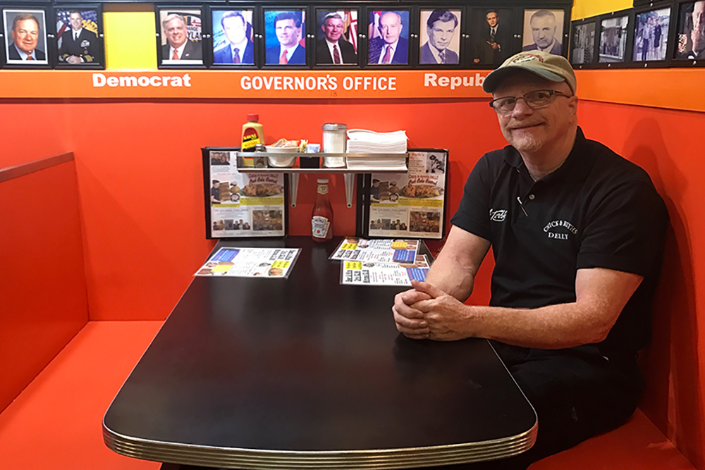 ANNAPOLIS, Md. -- Ted Levitt poses for a photo on the morning of Tuesday, Sept. 19, 2017, in the acclaimed governor’s booth inside Chick & Ruth’s Delly (Jess Feldman/Capital News Service).