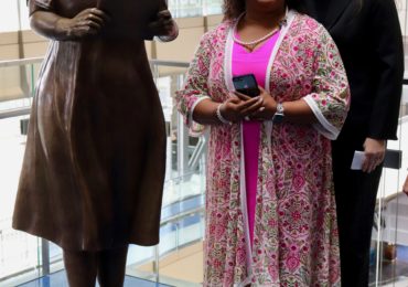 WASHINGTON - Amanda Matthews and Penny Allison Lockhart standing proud next to Alice Allison Dunnigan's newly inaugurated statue. (Albane Guichard/Capital News Service)