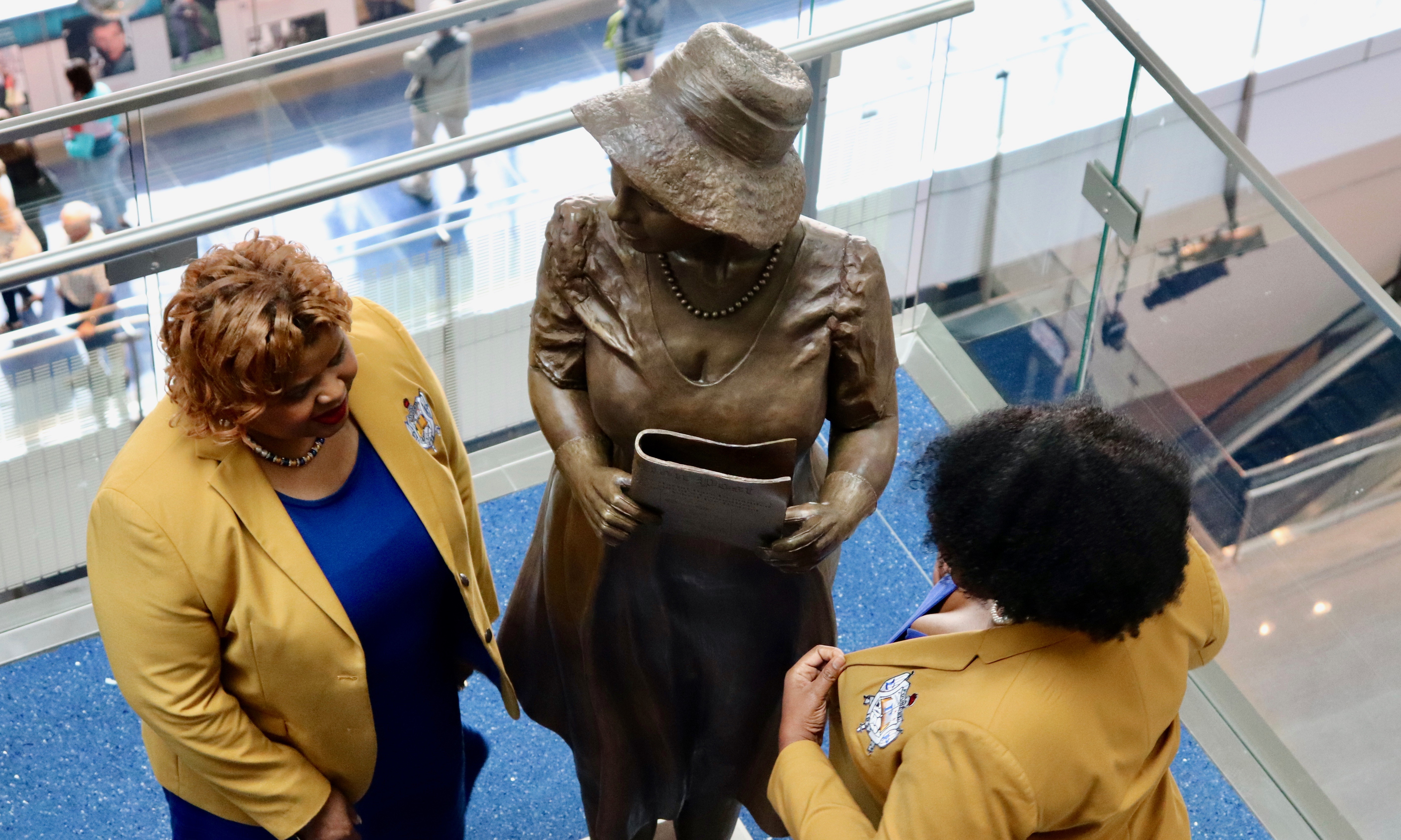 WASHINGTON - Two members of Alice Allison Dunnigan&#039;s sorority admire the statue of their Sigma Gamma Rho sister (Albane Guichard/Capital News Service)
