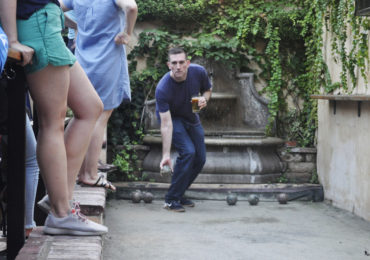 Trey Long sends the bocce ball rolling down the court at Vinoteca, a bar near Pleasant Plains in Washington, D.C.