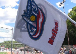 A flag featuring the Washington Glory's logo flies at one of the team's home games. The Washington Glory were a professional softball team from 2007-2009. (Photo credit: Paul Wilson)