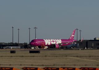 Wow Air jetliner sits idle on the tarmac of BWI Airport