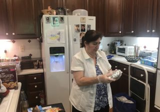 Theresa Bronson, a gig worker, prepares a meal for a catering customer. (Photos courtesy Jacob Bronson)