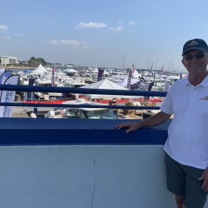 Paul Jacobs, president of the Annapolis Boat Shows, looks out at his fellow set-up crew setting up in hotter weather conditions.