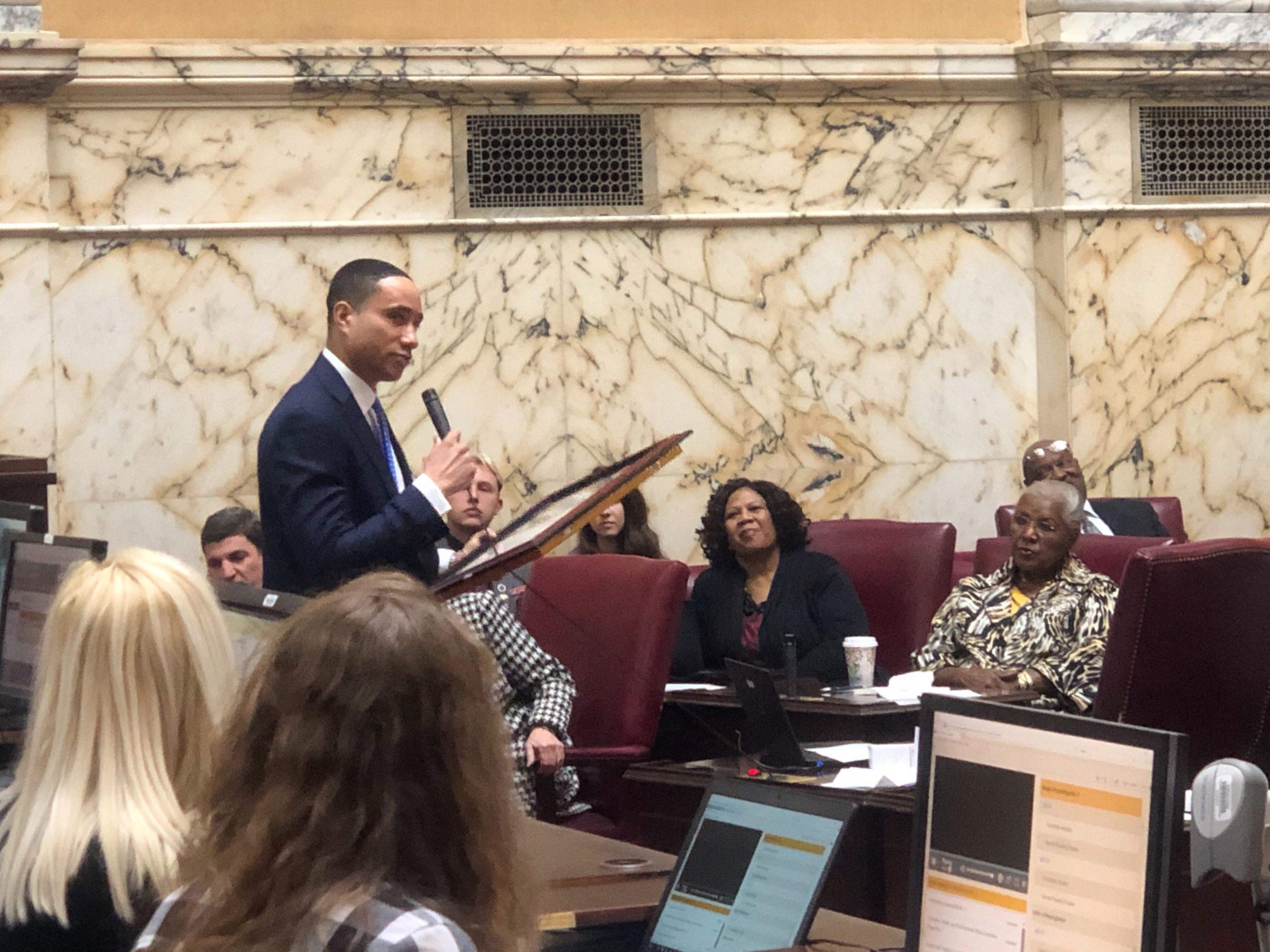 State Sen. William “Will” Smith Jr., D-Montgomery, presents an American flag flown over a United States base in Kabul, Afghanistan, to the Maryland Senate on Friday, January 10, 2020. The flag was flown over the base during his deployment on Sept. 11, 2019. Capital News Service Photo by Ryan E. Little.