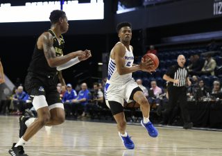 Hofstra guard Eli Pemberton drives against the Delaware defense in the Colonial Athletic Association Men's Basketball Tournament semifinal in Washington. Pemberton led the Pride with 24 points. (Photo: Rafael Suanes/CAA)