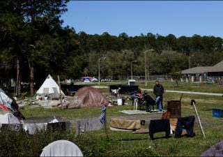 A tent encampment at Dignity Village, outside of the fence of GRACE Marketplace. (Chris Day/WUFT)