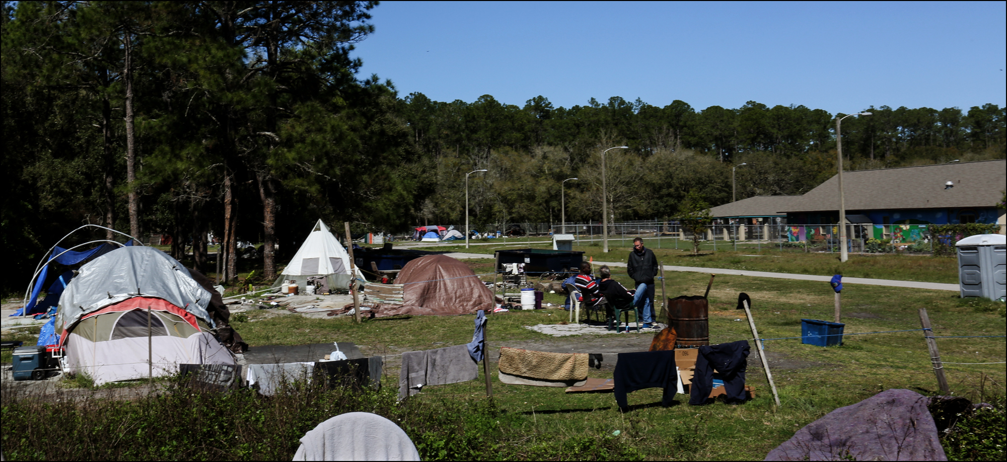 A tent encampment at Dignity Village, outside of the fence of GRACE Marketplace. (Chris Day/WUFT)