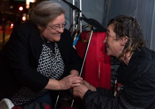 Valerie McEntee speaks with a homeless individual during one of her night walks in San Francisco. (Courtesy of San Francisco Night Ministry)
