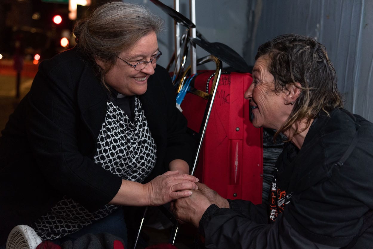 Valerie McEntee speaks with a homeless individual during one of her night walks in San Francisco. (Courtesy of San Francisco Night Ministry)