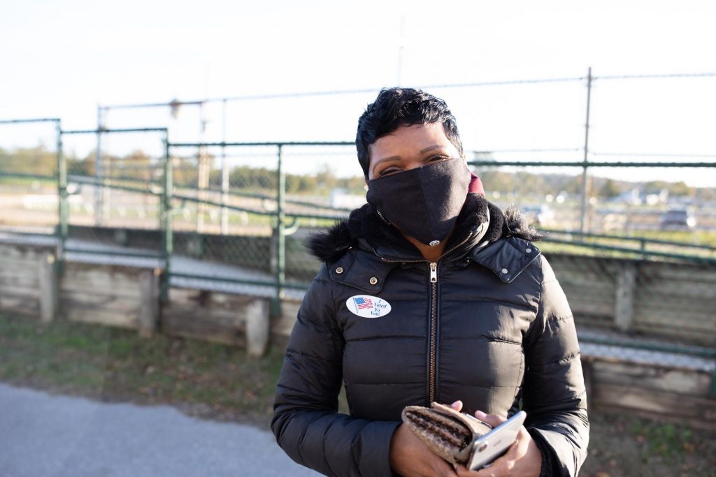 LaRhonda Hill Usher, 48, outside The Show Place Arena, said she voted for Joe Biden because she believes the scientists and doctors. (Photo by Brittany N. Gaddy)