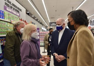 Gov. Larry Hogan and County Executive Angela Alsobrooks (right) meet with patients at a