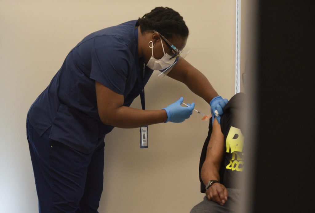 A Health Care for the Homeless worker vaccinates a patient on March 12, 2021. Health Care for the Homeless is a Baltimore-based organization working toward ending homelessness. Photo courtesy of the Maryland Department of Health.