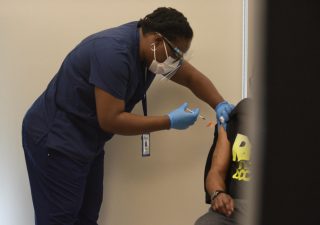 A Health Care for the Homeless worker vaccinates a patient on March 12, 2021. Health Care for the Homeless is a Baltimore-based organization working toward ending homelessness. Photo courtesy of the Maryland Department of Health.