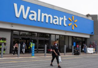 Customers walking out of a Walmart store during the COVID-19 pandemic