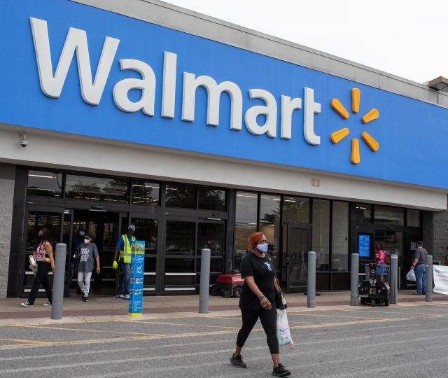 Customers walking out of a Walmart store during the COVID-19 pandemic