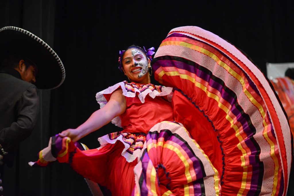 In 2016, a performer dances in a vibrant traditional dress and skeletal face paint at the Walters Art Museum’s Day of the Dead community celebration in Baltimore. (Photo: Maximilian Franz/courtesy of the Walters Art Museum) 