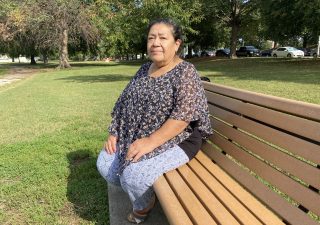 Cecilia Castelan, a Baltimore County resident whose brother died in March from COVID-19 in Mexico City, sits on a park bench in Baltimore on Oct. 16, 2021. (Photo: Trisha Ahmed / Capital News Service)