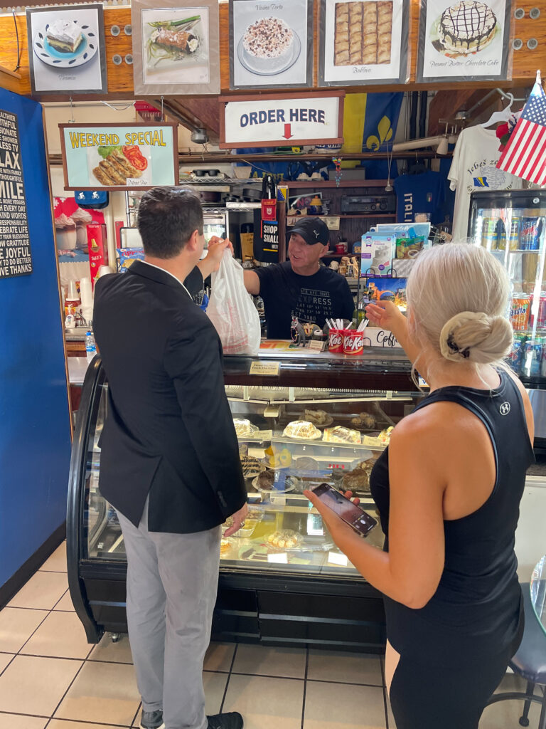 Republican gubernatorial nominee Dan Cox receives his order from Caporale’s Bakery in Cumberland, Md. on Sept. 9, 2022 (Photo provided by Dan Cox for Governor campaign)