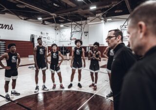 Bishop Walsh coach Dan Prete speaks with his team.