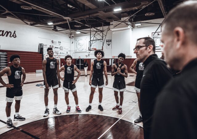 Bishop Walsh coach Dan Prete speaks with his team.