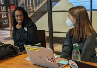 Nneka N'namdi, founder of Fight Blight Bmore, discusses her work with Capital News Service reporters. (Photo by Rob Wells/Capital News Service)