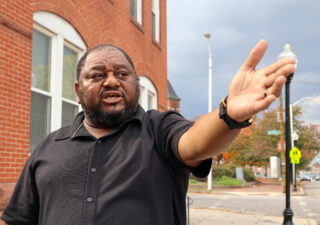 Rev. Dr. Derrick DeWitt Sr. in West Baltimore. (Photo: Esther Frances/Capital News Service)