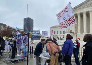 WASHINGTON - Protesters gathered outside the Supreme Court Wednesday as justices heard oral arguments over how much power state legislatures should have over elections. (Destiny Herbers/Capital News Service)