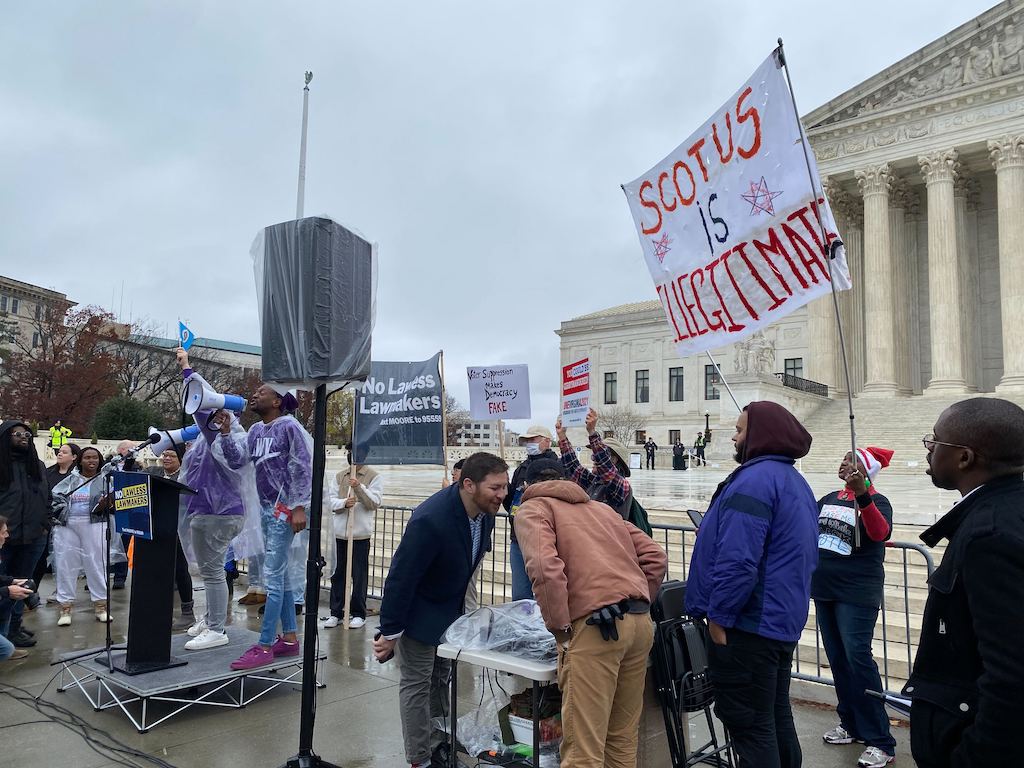 WASHINGTON - Protesters gathered outside the Supreme Court Wednesday as justices heard oral arguments over how much power state legislatures should have over elections. (Destiny Herbers/Capital News Service)